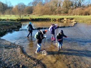 Children river dipping at Grattons Park, Crawley
