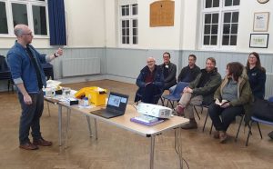 Lewis briefs the volunteers on how to use the kits to test for pollution on the River Mole